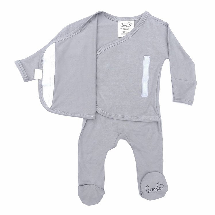 Stockist of Bonsie's rayon blend fog grey footie.  Top section has velcro wrap body which can be undone for skin to skin contact.  Elastic waist that can be pulled down for easy diaper changes. 