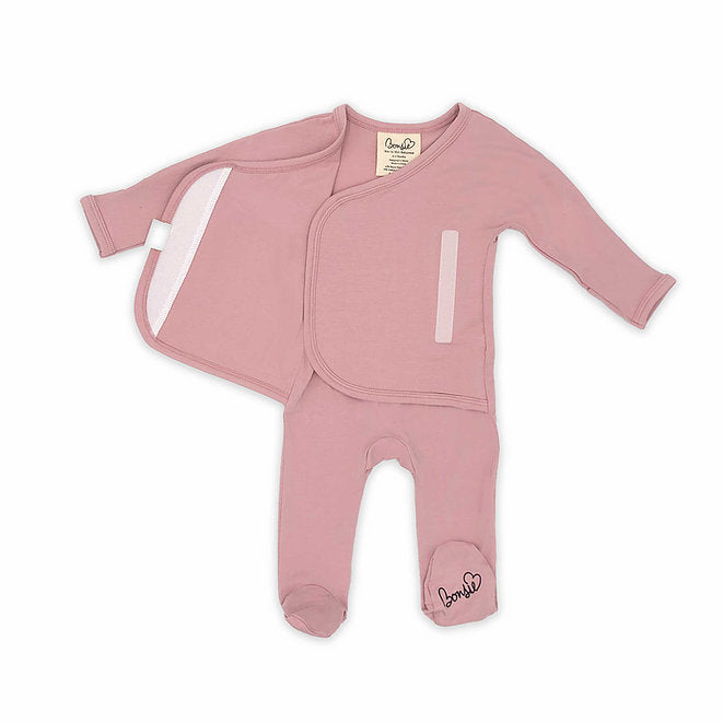 Stockist of Bonsie's rayon blend Peony pink footie.  Top section has velcro wrap body which can be undone for skin to skin contact.  Elastic waist that can be pulled down for easy diaper changes. 
