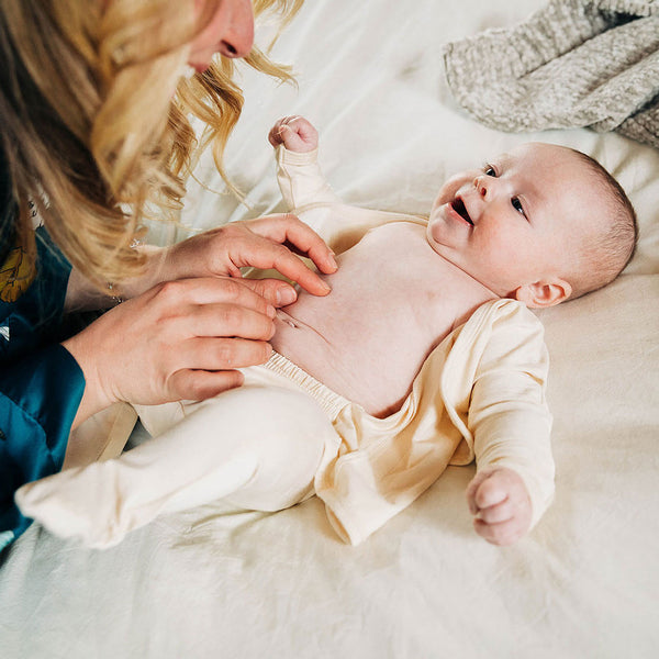 Stockist of Bonsie's rayon blend Oat footie.  Top section has velcro wrap body which can be undone for skin to skin contact.  Elastic waist that can be pulled down for easy diaper changes. 