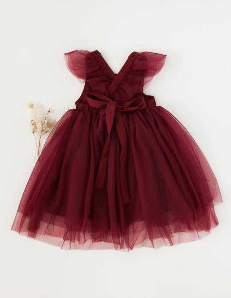 US stockist of Karibou Kid's Scarlett Tutu Dress.  Made from a soft cotton blend with midi length tulle skirt.  Features open back with a big bow.