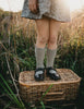 US stockist of Karibou Kid's Conifer cotton socks. Dusty sage green color with mesh texture and frill at top. Cotton blend.