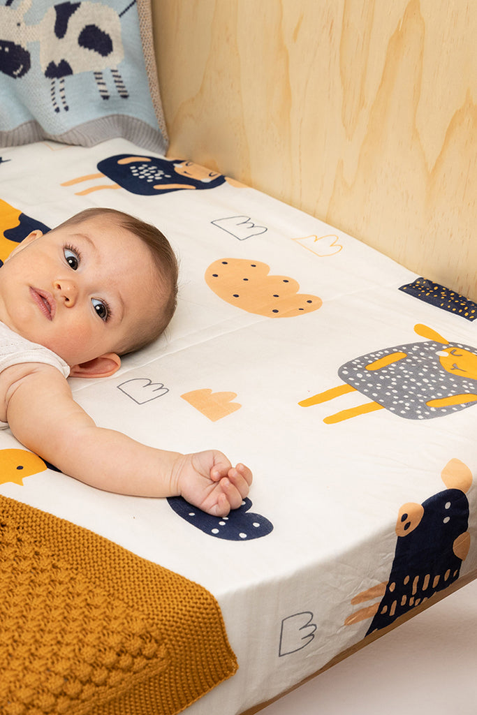 US stockist of Indus Design's cotton "Farmyard Animals" swaddle.