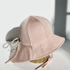 US stockist of Fini the Label's gender neutral, floppy swim hat in Shimmer Champagne. Features elongated back for added sun protection, chin strap and adjustable bow around crown for better fit. Brim is medium stiffness and can be flipped up at front.  Made from nylon/spandex and is quick drying.