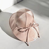 US stockist of Fini the Label's gender neutral, floppy swim hat in Shimmer Champagne. Features elongated back for added sun protection, chin strap and adjustable bow around crown for better fit. Brim is medium stiffness and can be flipped up at front.  Made from nylon/spandex and is quick drying.