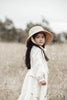 US stockist of Fini the Label's vintage French style straw hat.  Made from raffia straw with a wide bell shaped brim and a trimmed natural ribbon beget chin strap.