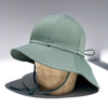 US stockist of Fini the Label's gender neutral, floppy swim hat in Ivy Green. Features elongated back for added sun protection, chin strap and adjustable bow around crown for better fit. Brim is medium stiffness and can be flipped up at front.  Made from nylon/spandex and is quick drying.