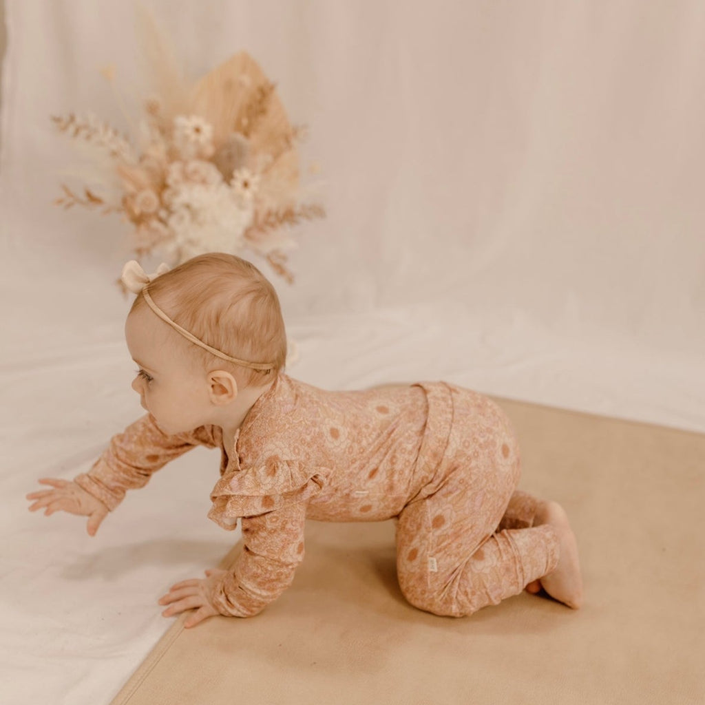 US stockist of India & Grace's Organic long sleeve ruffle bodysuit in Bloom Floral.