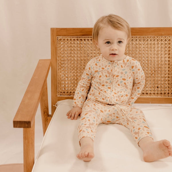 US stockist of India & Grace's gender neutral, organic bamboo zip suit in Dino Terrazzo.