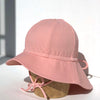 US stockist of Fini the Label's floppy swim hat in pink. Features elongated back for added sun protection, chin strap and adjustable bow around crown for better fit. Brim is medium stiffness and can be flipped up at front.  Made from nylon/spandex and is quick drying.