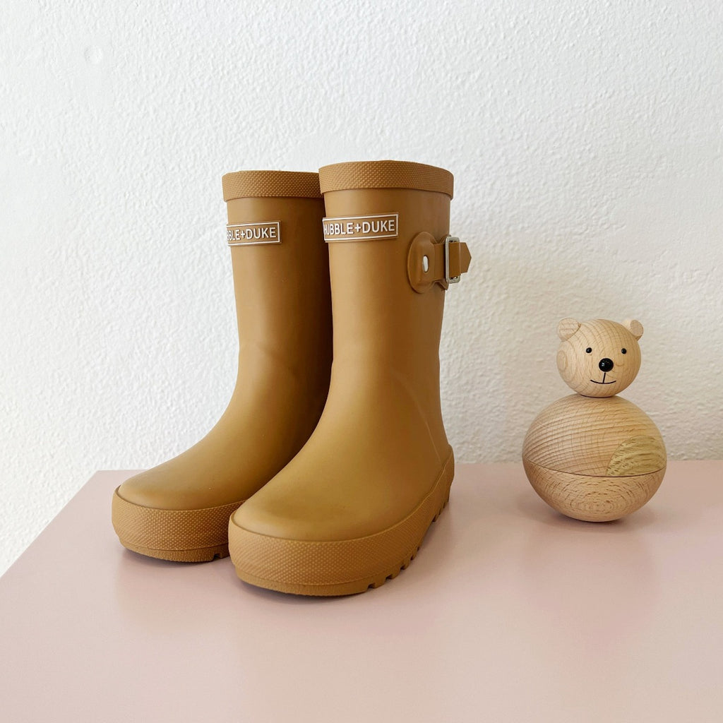 US stockist of Hubble & Duke's gender neutral, natural rubber rainboots in Sandstone.