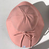 US stockist of Fini the Label's floppy swim hat in pink. Features elongated back for added sun protection, chin strap and adjustable bow around crown for better fit. Brim is medium stiffness and can be flipped up at front.  Made from nylon/spandex and is quick drying.