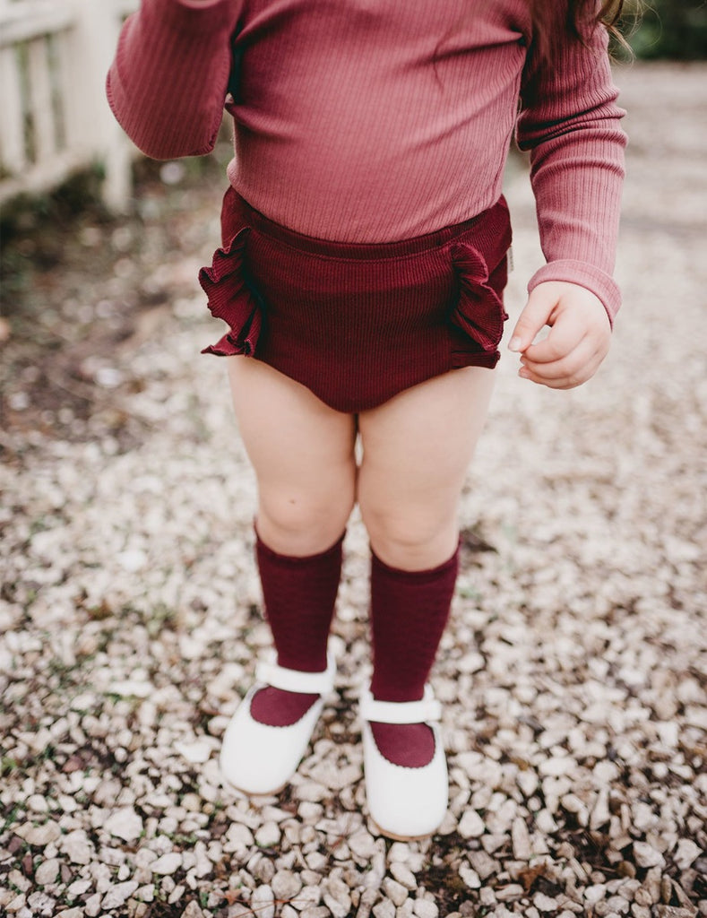US stockist of Karibou Kids plum Georgia ribbed ruffle bloomers