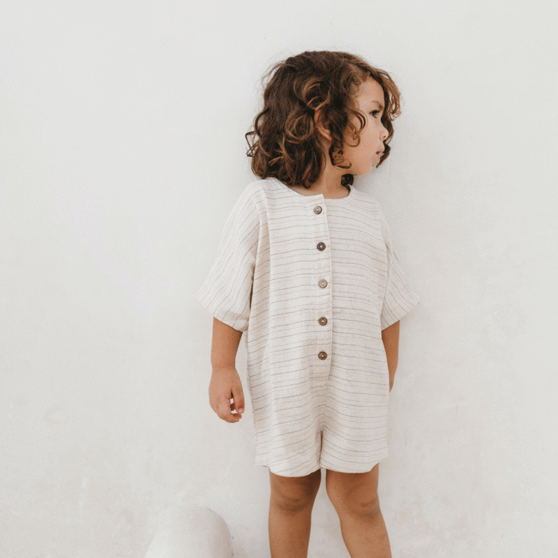 US stockist of Illoura the Label's gender neutral, short, Pinstripe Wilder Overalls.  Features coconut buttons down front.
