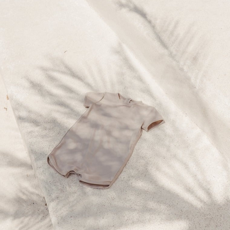 US stockist of Illoura the Label's Wren Rashsuit in Pale Khaki.  Made from UPF 50, Econyl fabric.