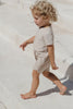 US stockist of Illoura the Label's Wren Rashsuit in Pale Khaki.  Made from UPF 50, Econyl fabric.