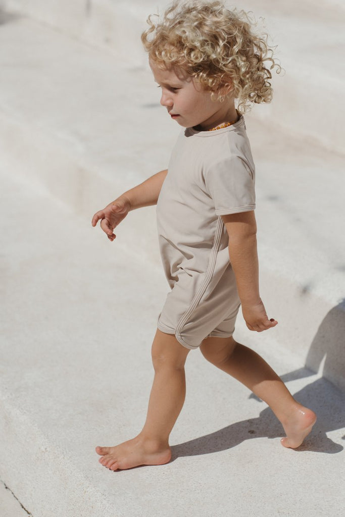 US stockist of Illoura the Label's Wren Rashsuit in Pale Khaki.  Made from UPF 50, Econyl fabric.