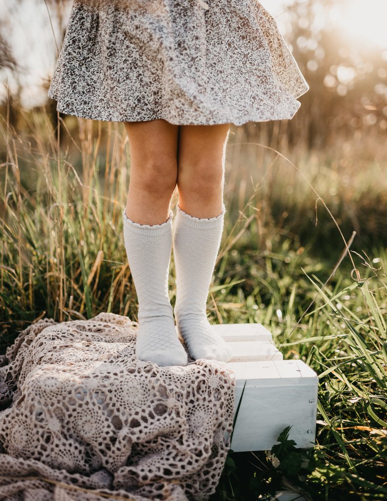 US stockist of Karibou Kid's Cloud cotton socks. Light sky blue color with mesh texture and frill at top. Cotton blend.