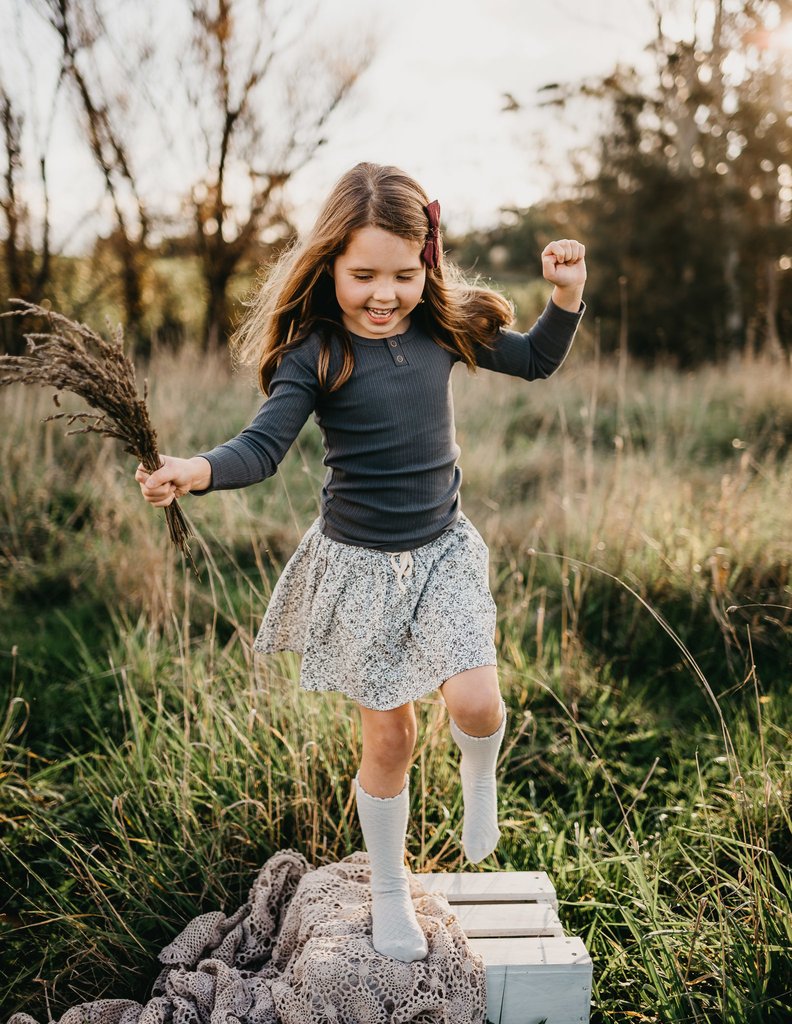 US stockist of Karibou Kid's Cloud cotton socks. Light sky blue color with mesh texture and frill at top. Cotton blend.