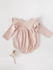 US stockist of Karibou Kid's Milana Winged Playsuit in soft pink.  Made from soft cotton, featuring long sleeves and ruffled wings at shoulders.