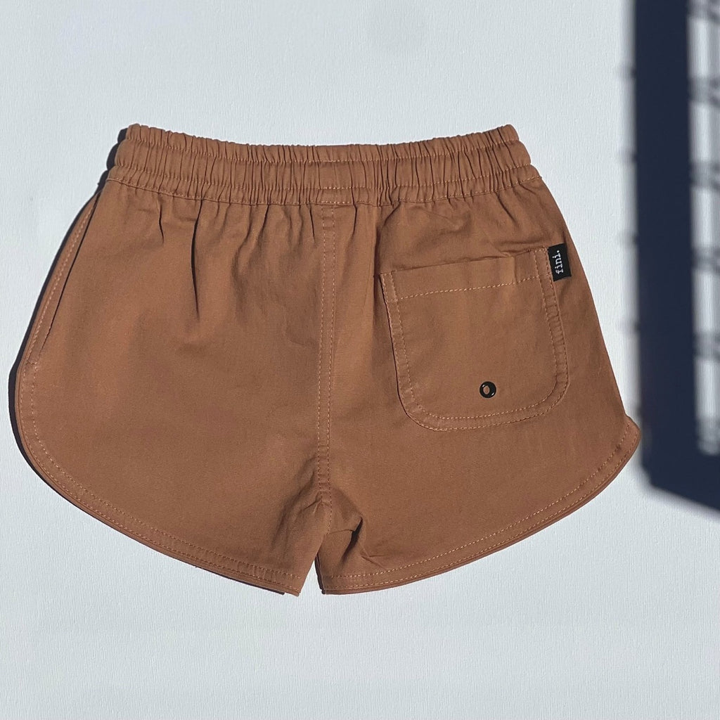 US stockist of Fini. the Label's soft cotton canvas boardshorts in Mocha.