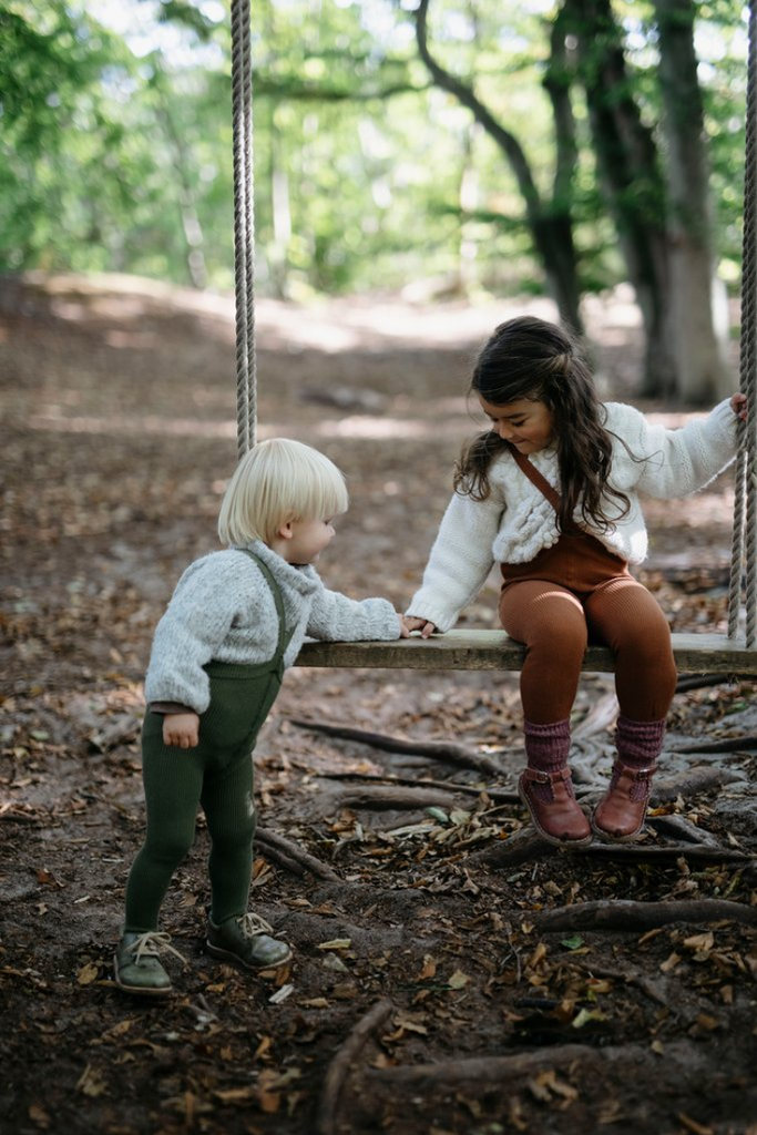 US stockist of Silly Silas gender neutral retro ribbed footed tights in olive.  Made from 100% cotton and features braces.