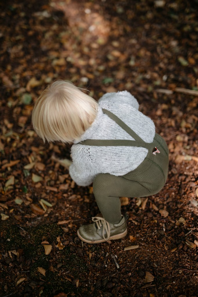US stockist of Silly Silas gender neutral retro ribbed footed tights in olive.  Made from 100% cotton and features braces.