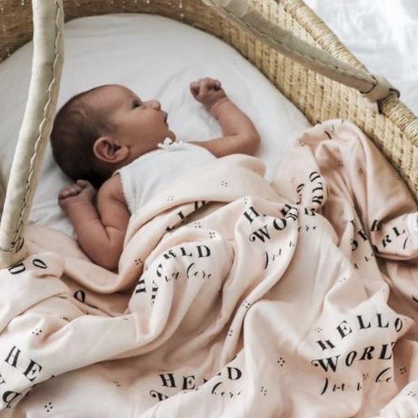 US stockist of Piper Bug peach jersey cotton wrap with hello world, I'm new here print