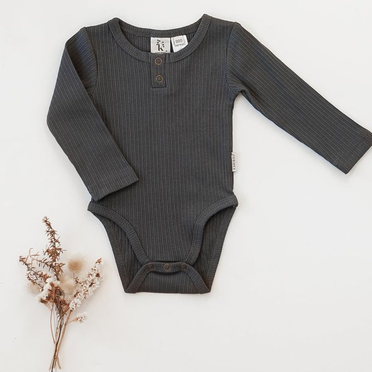 US stockist of Karibou Kids gender neutral, pepper grey Willow long sleeve henley bodysuit in ribbed cotton blend.