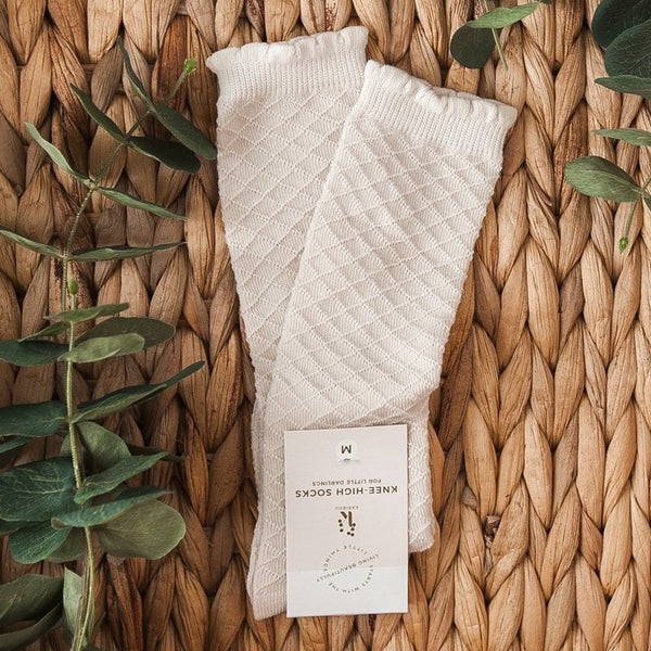 US stockist of Karibou Kid's Macaroon cotton socks. Light beige color with mesh texture and frill at top. Cotton blend.