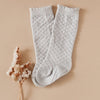 US stockist of Karibou Kid's Cloud cotton socks. Light sky blue color with mesh texture and frill at top. Cotton blend.