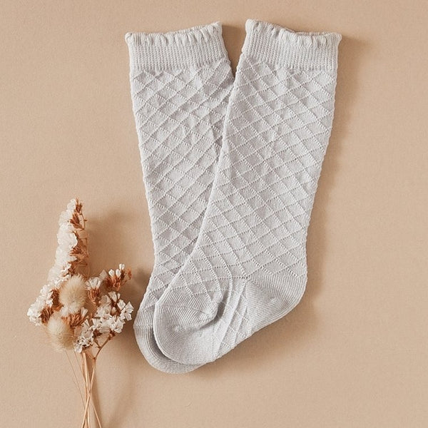 US stockist of Karibou Kid's Cloud cotton socks. Light sky blue color with mesh texture and frill at top. Cotton blend.