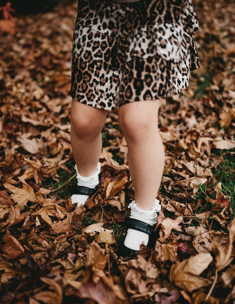 US stockist of Karibou Kid's white ankle pom pom ruffle socks.  Made from a cotton blend.