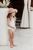 US stockist of Fini the Label's gender neutral, floppy swim hat in cocoa. Features elongated back for added sun protection, chin strap and adjustable bow around crown for better fit. Brim is medium stiffness and can be flipped up at front.  Made from nylon/spandex and is quick drying.