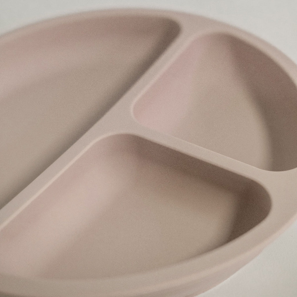 US stockist of Foxx & Willow's Dusty Blush silicone suction plate with 3 sections. Comes with matching wood + silicone fork.  Plate measures 7.80" in diameter and fork measures 5.51" in length.