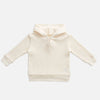 US stockist of Miann & Co's gender neutral jetstream cream baby waffle hooded sweatshirt.  Made from 100% waffle cotton.