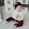 US stockist of Karibou Kids' whimsy love ruffle sleeve, cotton waffle top in snow white.  Features keyhole tie front of neck.