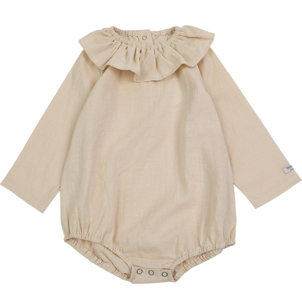 US stockist of Donsje's long sleeve chloe bodysuit in Buttercream.  Made from cotton with a ruffle neck.